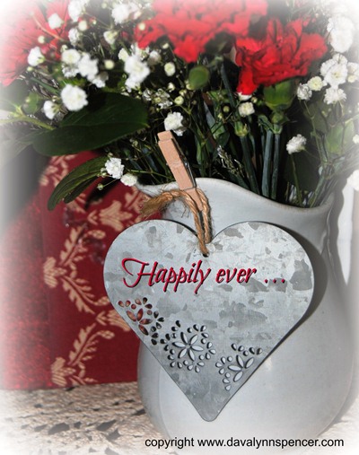 ALT="Flowers in pitcher with heart"
