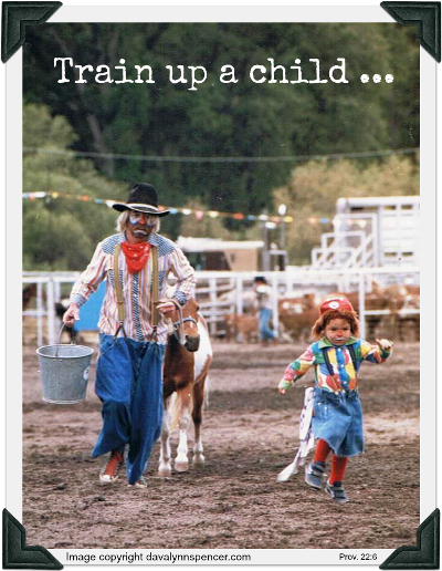 ALT TEXT="Rodeo clown and child running with pony"