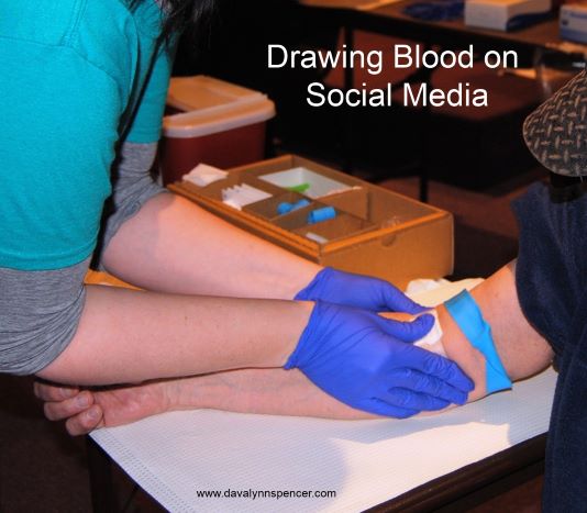 ALT="nurse drawing blood"