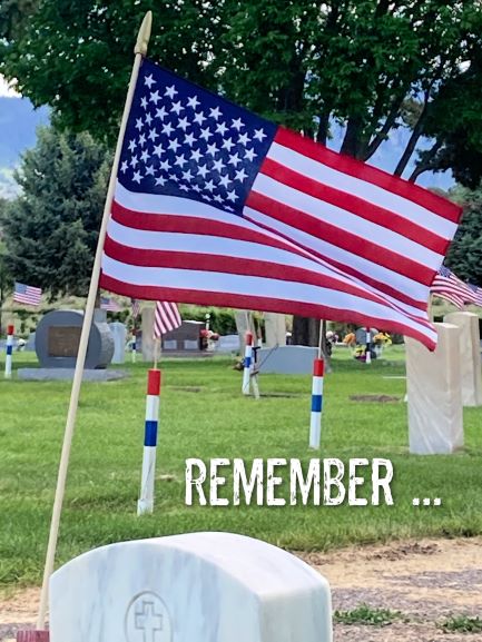 ALT="American flag and grave marker"