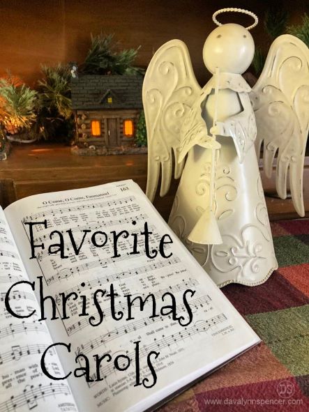ALT="Christmas carols and angel"