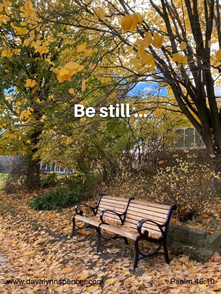 ALT="park bench in city"