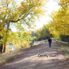 ALT="man walking along river"