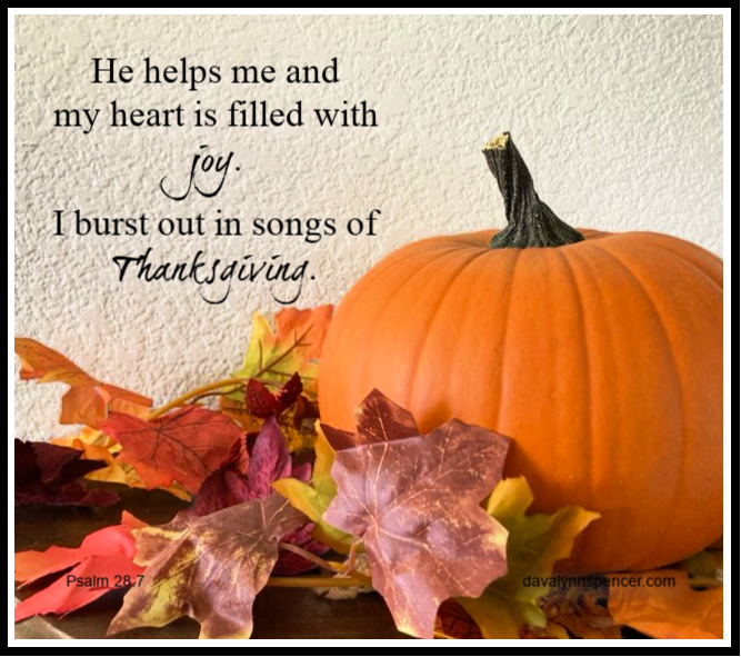 ALT="big orange pumpkin and fall leaves"